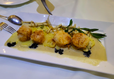 Olio Restaurant & Lounge signature dishes Baked Organic Herb Chicken
Chilean Seabass
Gambas Al Ajillo